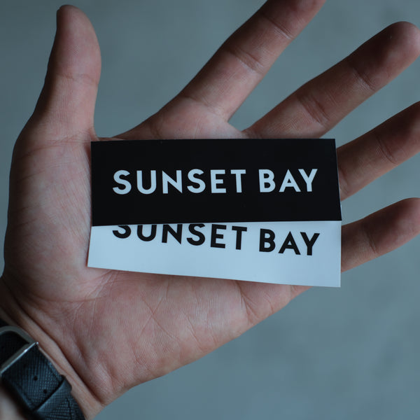 SUNSET BAY - BOX LOGO STICKER -BLACK-